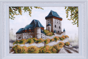 Ein h├Âlzerner Bilderrahmen mit einem Haus.