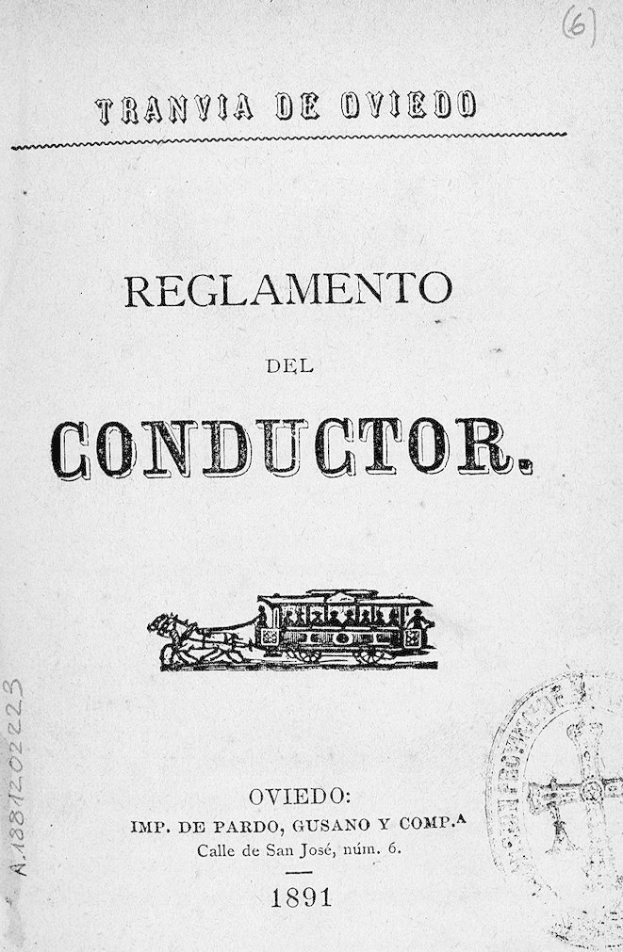 Ein altes Buch mit einer Zeichnung eines Zugs auf dem Titelblatt, mit der Inschrift 'Reglamento de Conductor' und einem Stempel auf der rechten Seite.