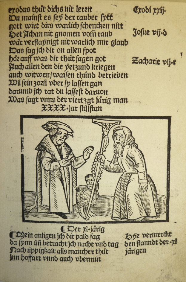Eine bedruckte Seite in einer fremden Sprache mit zwei Männern daneben, möglicherweise aus einem Lehrbuch.